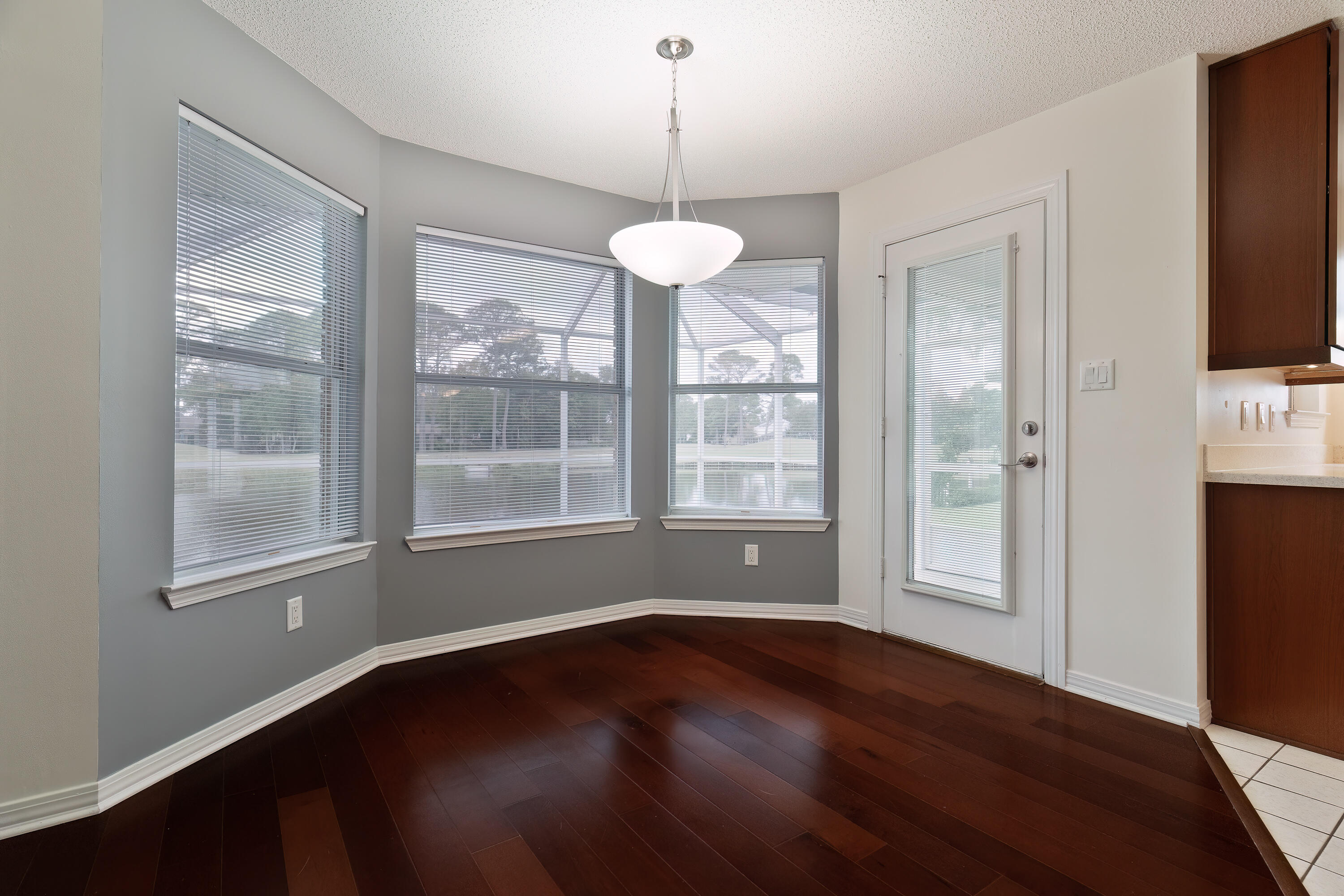 946 Shalimar Point Drive Shalimar, FL 32579 - Photo 21 of 63 a view of an empty room with wooden floor and a window