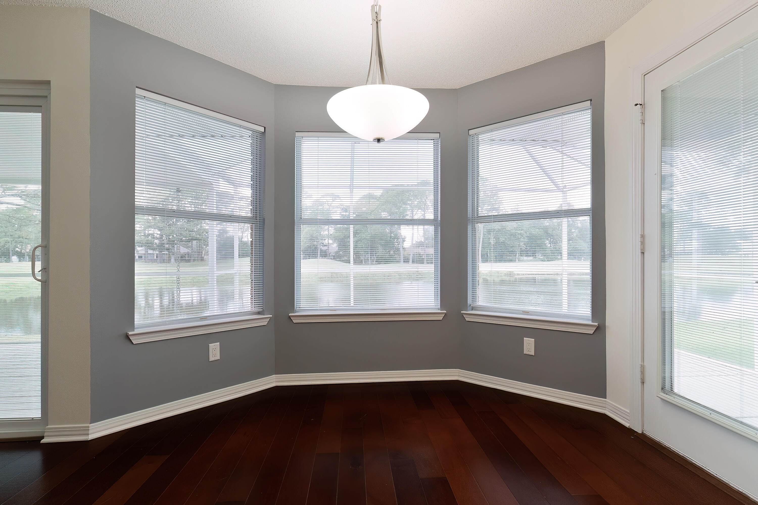 946 Shalimar Point Drive Shalimar, FL 32579 - Photo 23 of 63 a view of an empty room with wooden floor and a window
