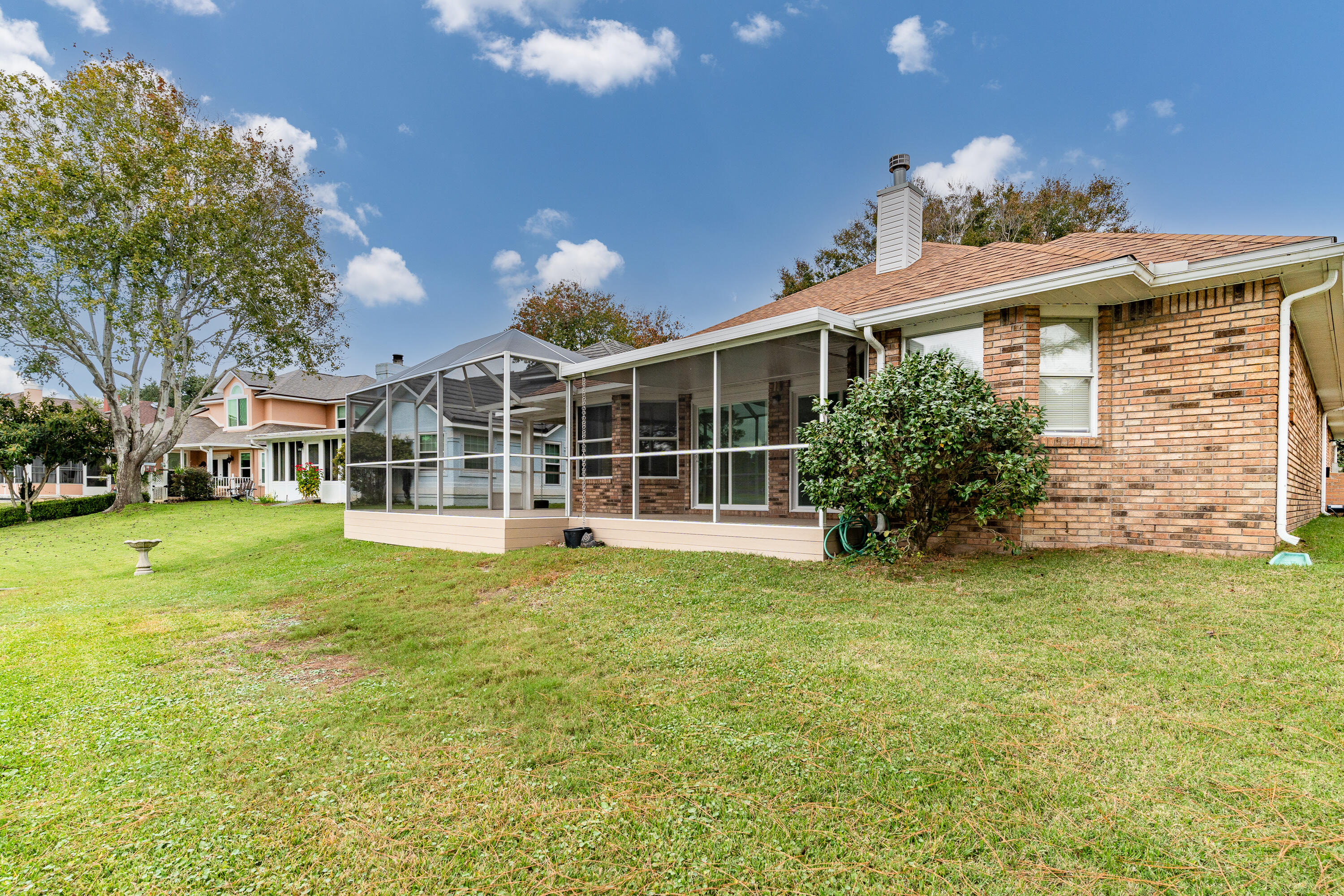 946 Shalimar Point Drive Shalimar, FL 32579 - Photo 26 of 63 a view of a house with a garden and yard