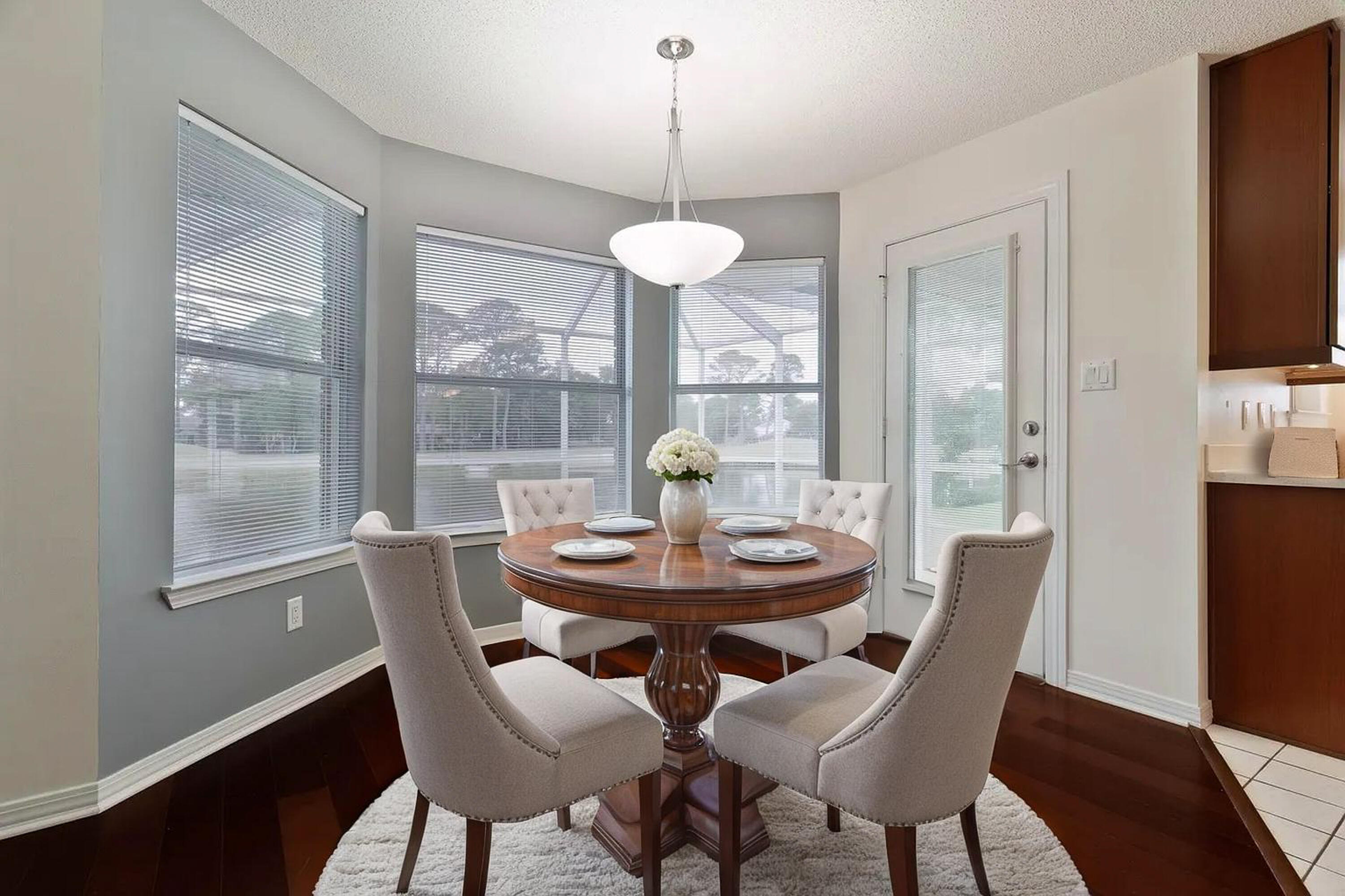 946 Shalimar Point Drive Shalimar, FL 32579 - Photo 3 of 63 a view of a dining room with furniture wooden floor and a chandelier