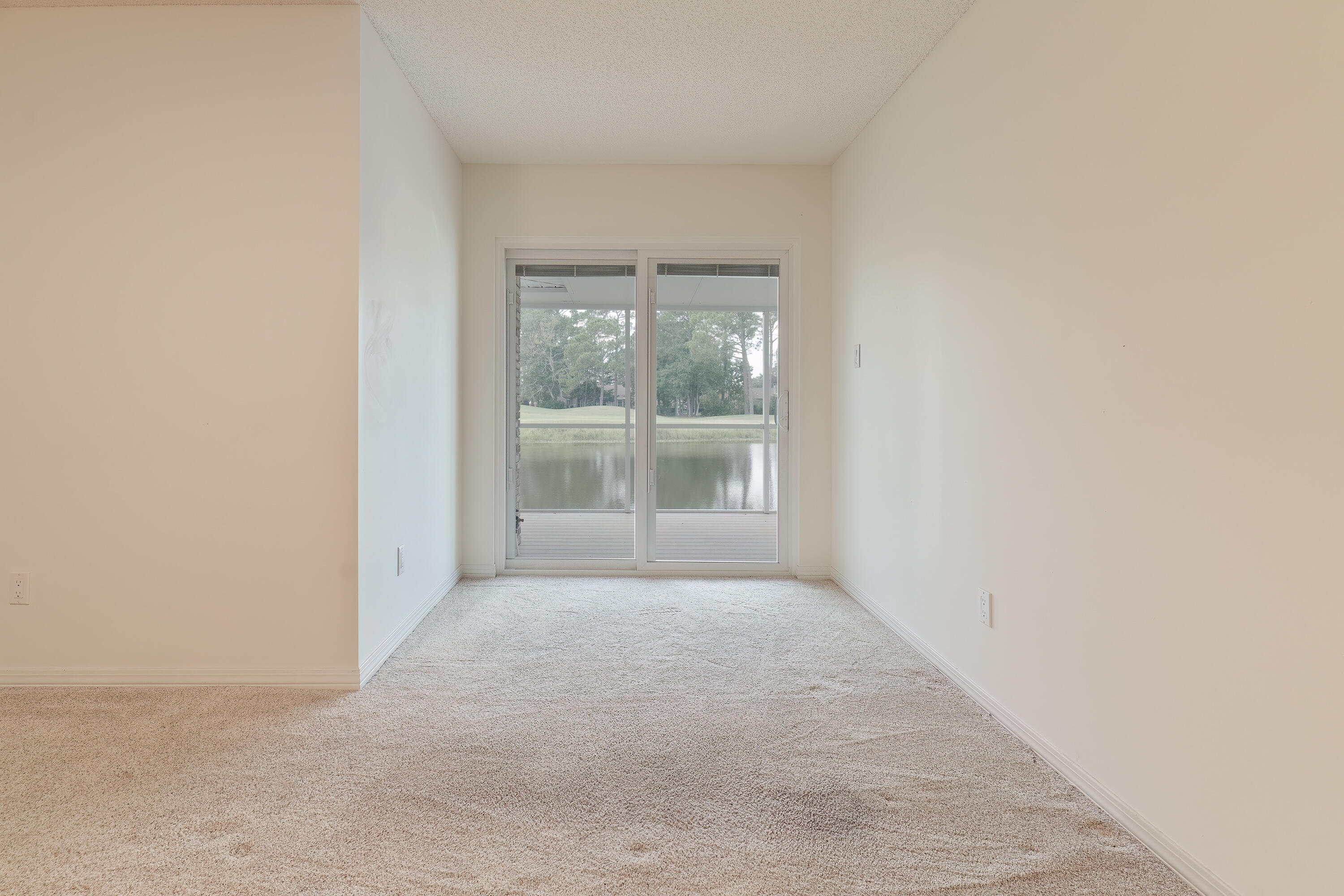 946 Shalimar Point Drive Shalimar, FL 32579 - Photo 45 of 63 an empty room with large windows