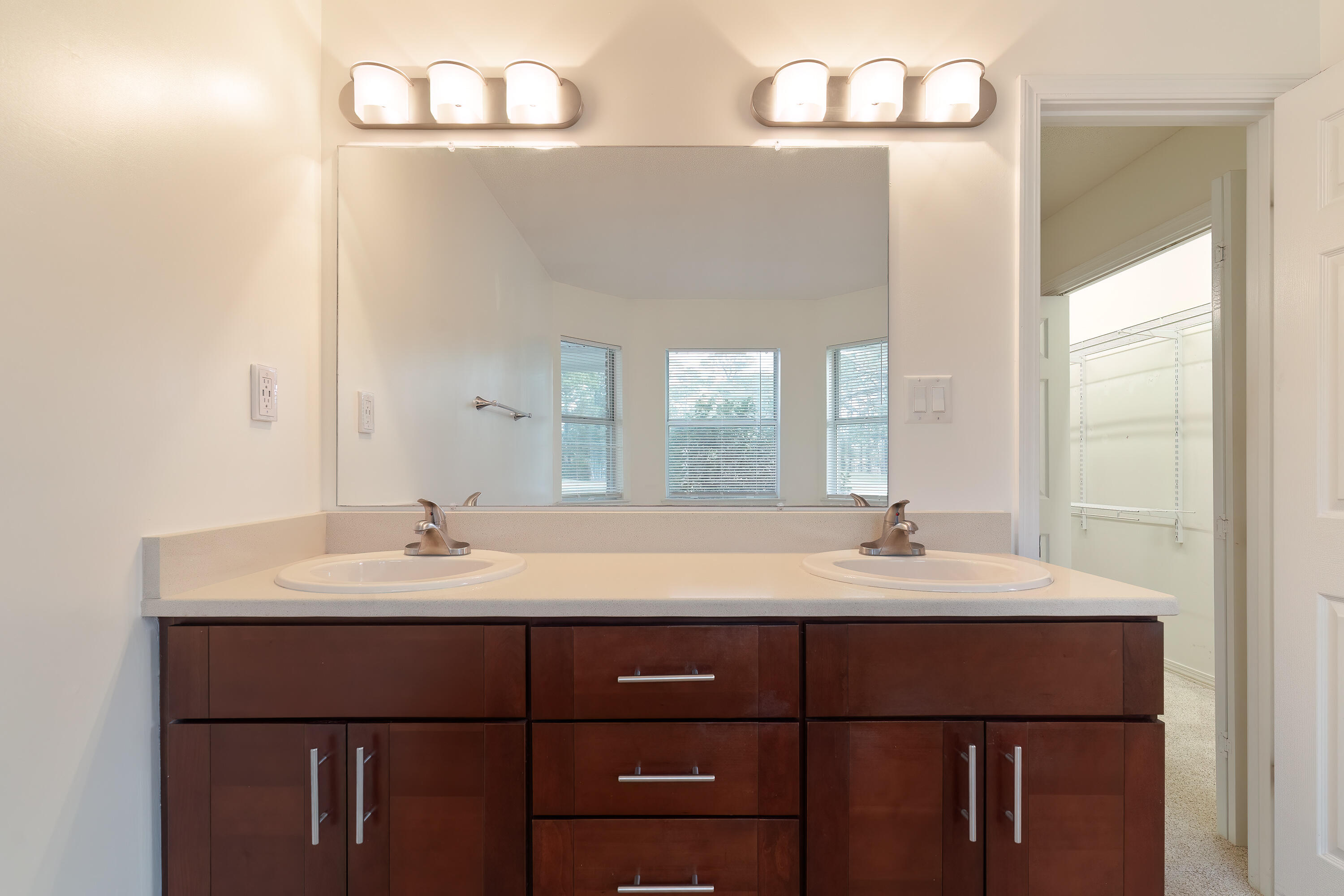 946 Shalimar Point Drive Shalimar, FL 32579 - Photo 48 of 63 a bathroom with a double vanity sink and a mirror