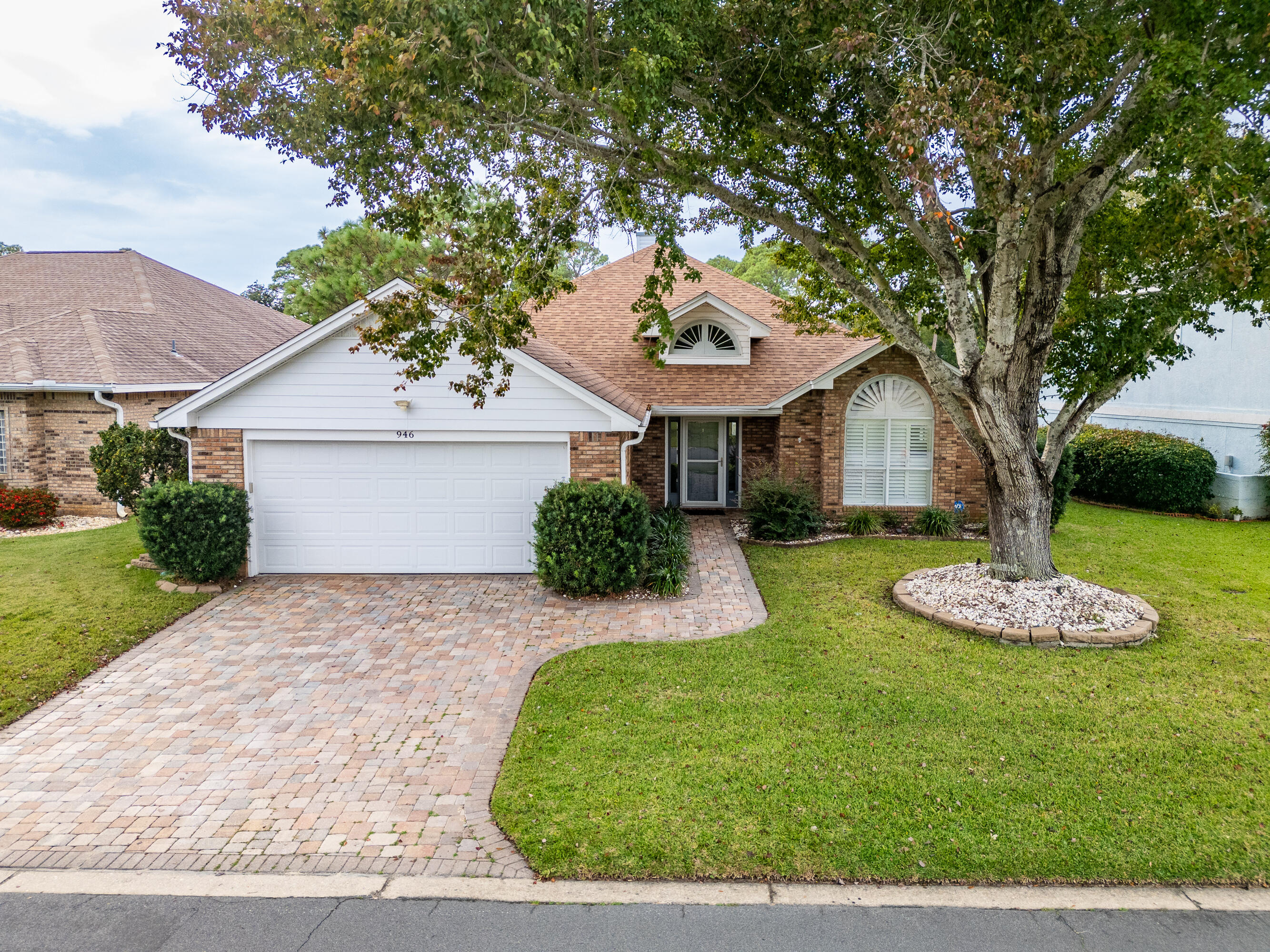 946 Shalimar Point Drive Shalimar, FL 32579 - Photo 55 of 63 a front view of a house with a yard and garage