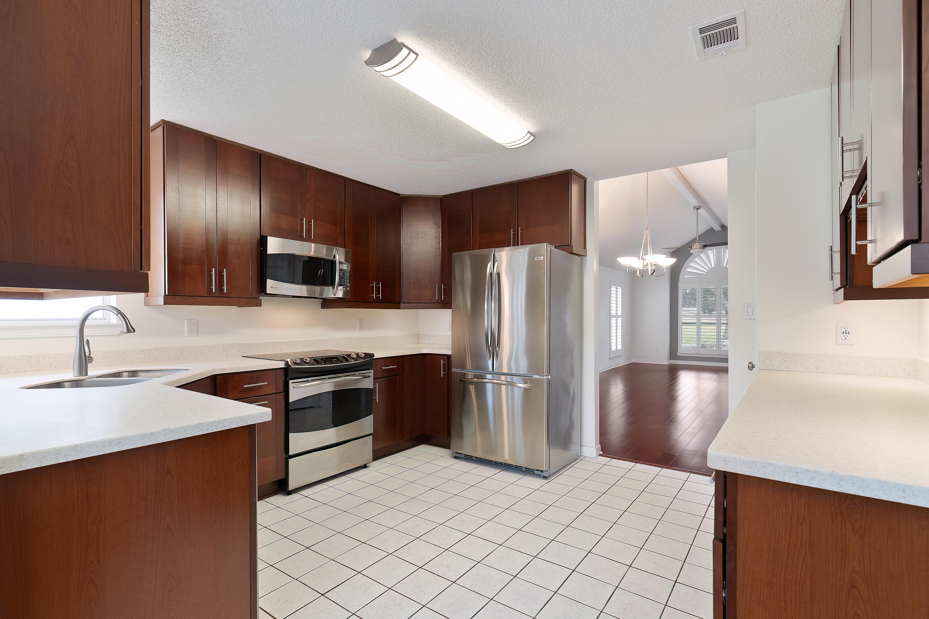 946 Shalimar Point Drive Shalimar, FL 32579 - Photo 8 of 63 a kitchen with stainless steel appliances granite countertop a refrigerator sink and stove