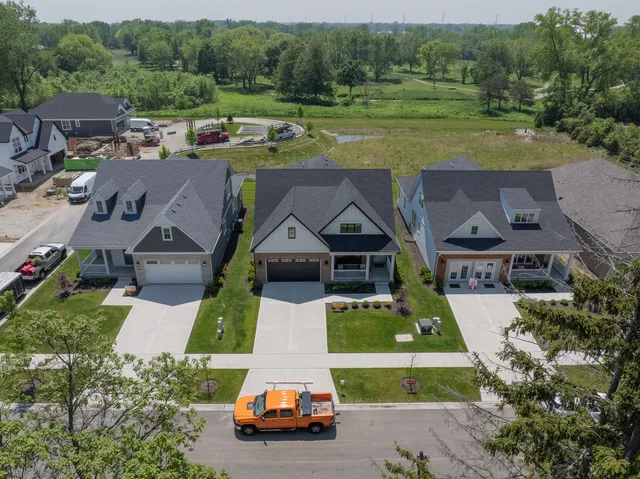 an aerial view of a house with pool