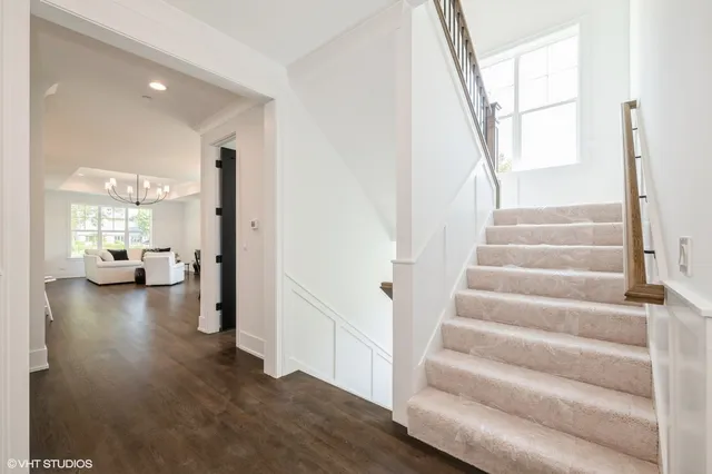 a view of entryway and hall with wooden floor