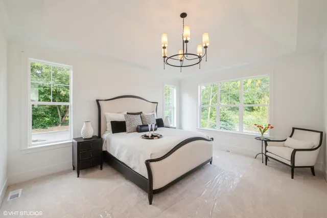 a bedroom with a bed a window and couch