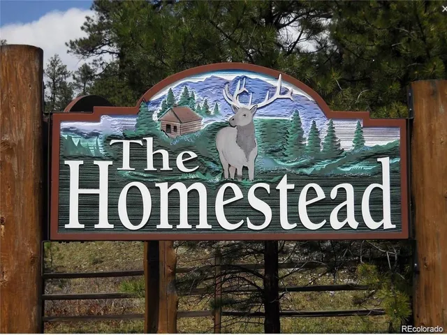 a sign broad on a brick wall