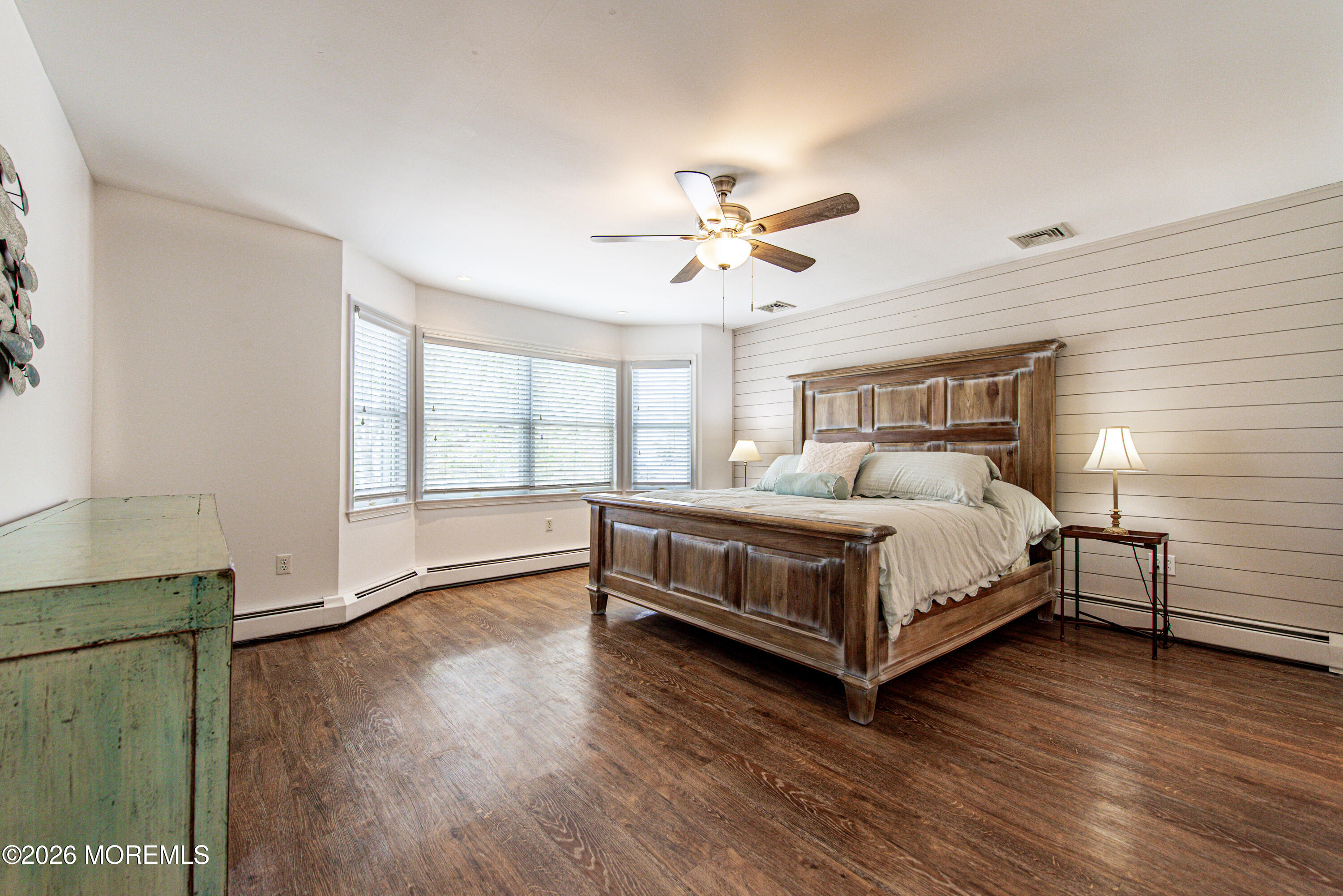 5 A Sunset Boulevard Barnegat Light, NJ 08006 - Photo 24 of 65 a bedroom with a bed chandelier and a window