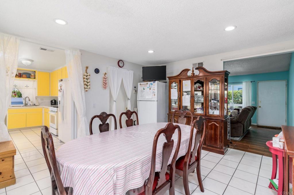 29302 Edgewood Road San Juan Capistrano, CA 92675 - Photo 11 of 57 a view of a dining room with furniture and chandelier