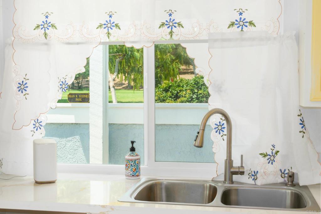 29302 Edgewood Road San Juan Capistrano, CA 92675 - Photo 17 of 57 a bathroom with a tub sink and mirror