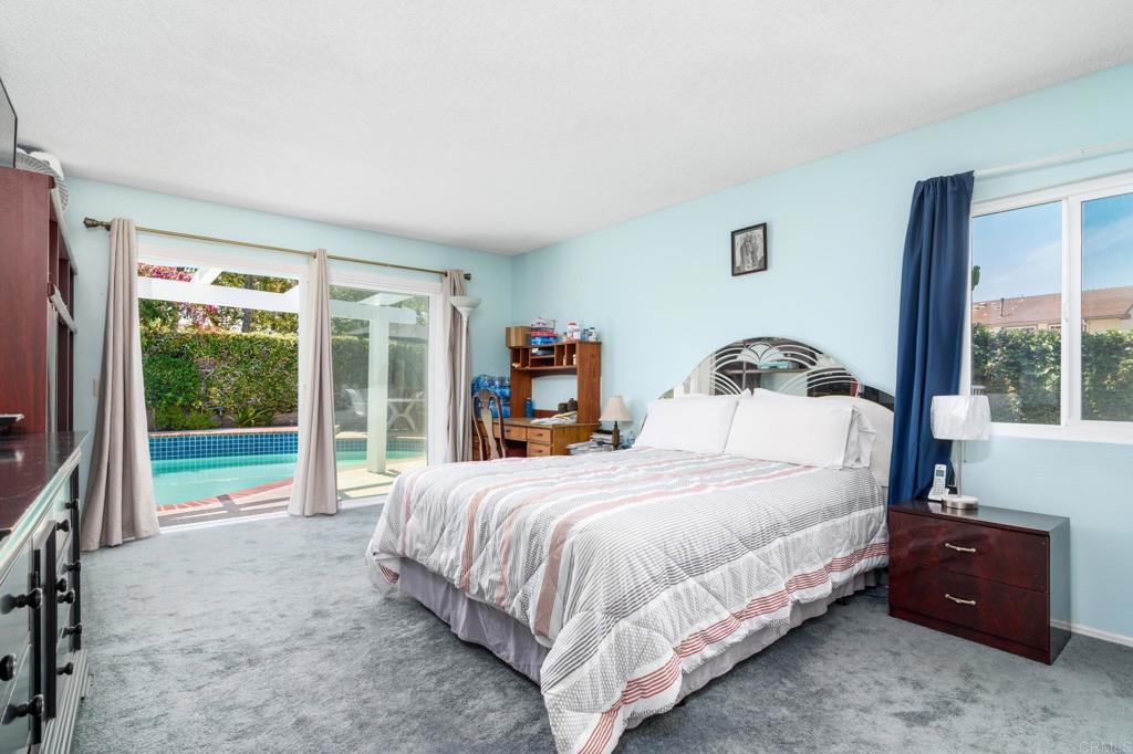 29302 Edgewood Road San Juan Capistrano, CA 92675 - Photo 18 of 57 a bedroom with a bed and large windows