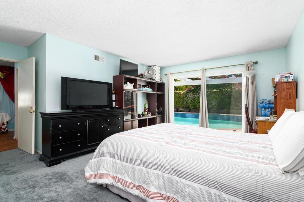 29302 Edgewood Road San Juan Capistrano, CA 92675 - Photo 19 of 57 a bedroom with a bed and a flat screen tv