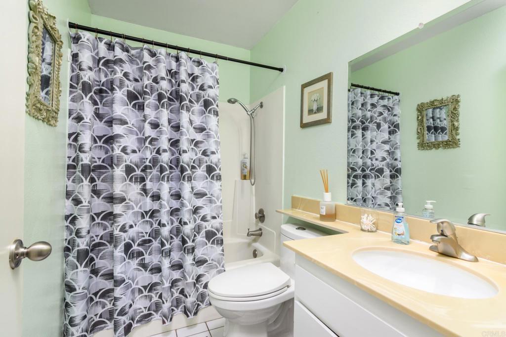 29302 Edgewood Road San Juan Capistrano, CA 92675 - Photo 26 of 57 a bathroom with a sink toilet and shower