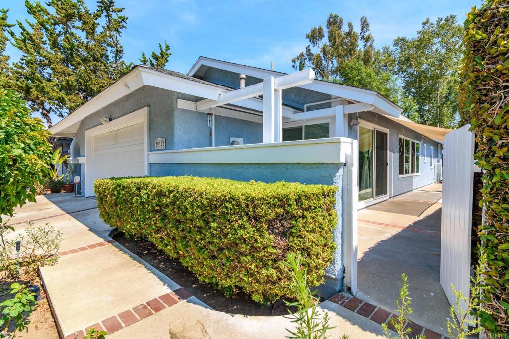 29302 Edgewood Road San Juan Capistrano, CA 92675 - Photo 39 of 57 a front view of a house with a garden