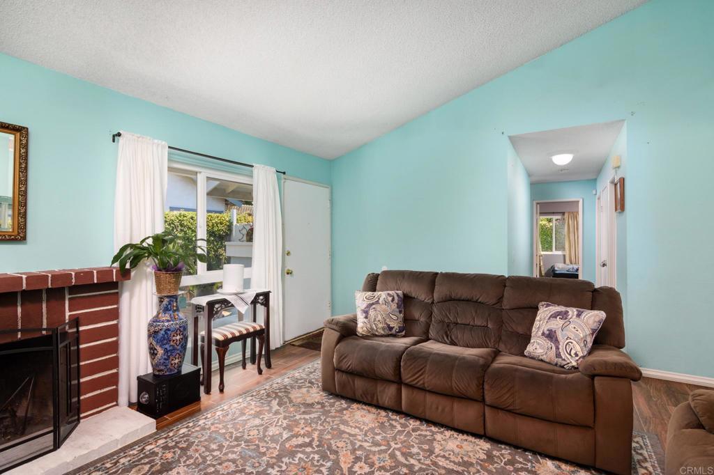 29302 Edgewood Road San Juan Capistrano, CA 92675 - Photo 10 of 57 a living room with furniture and a fireplace