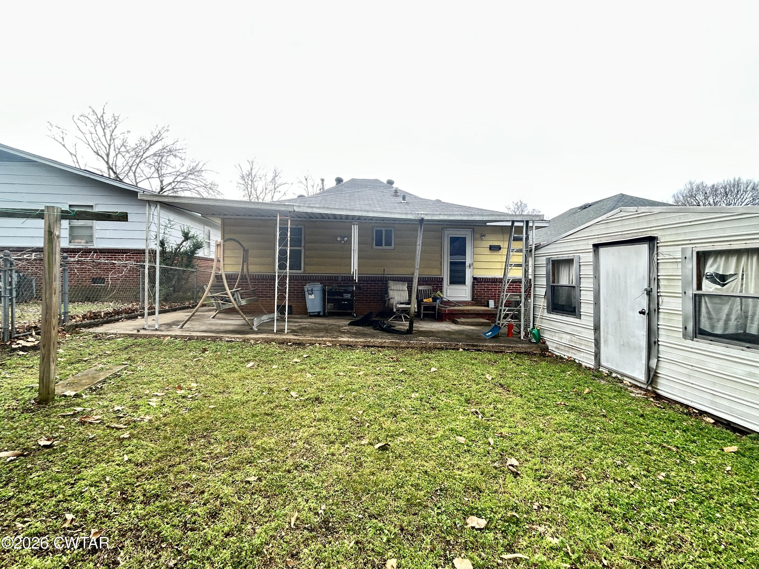 258 Oak Street Jackson, TN 38301 - Photo 18 of 22 a view of a house with backyard porch and sitting area