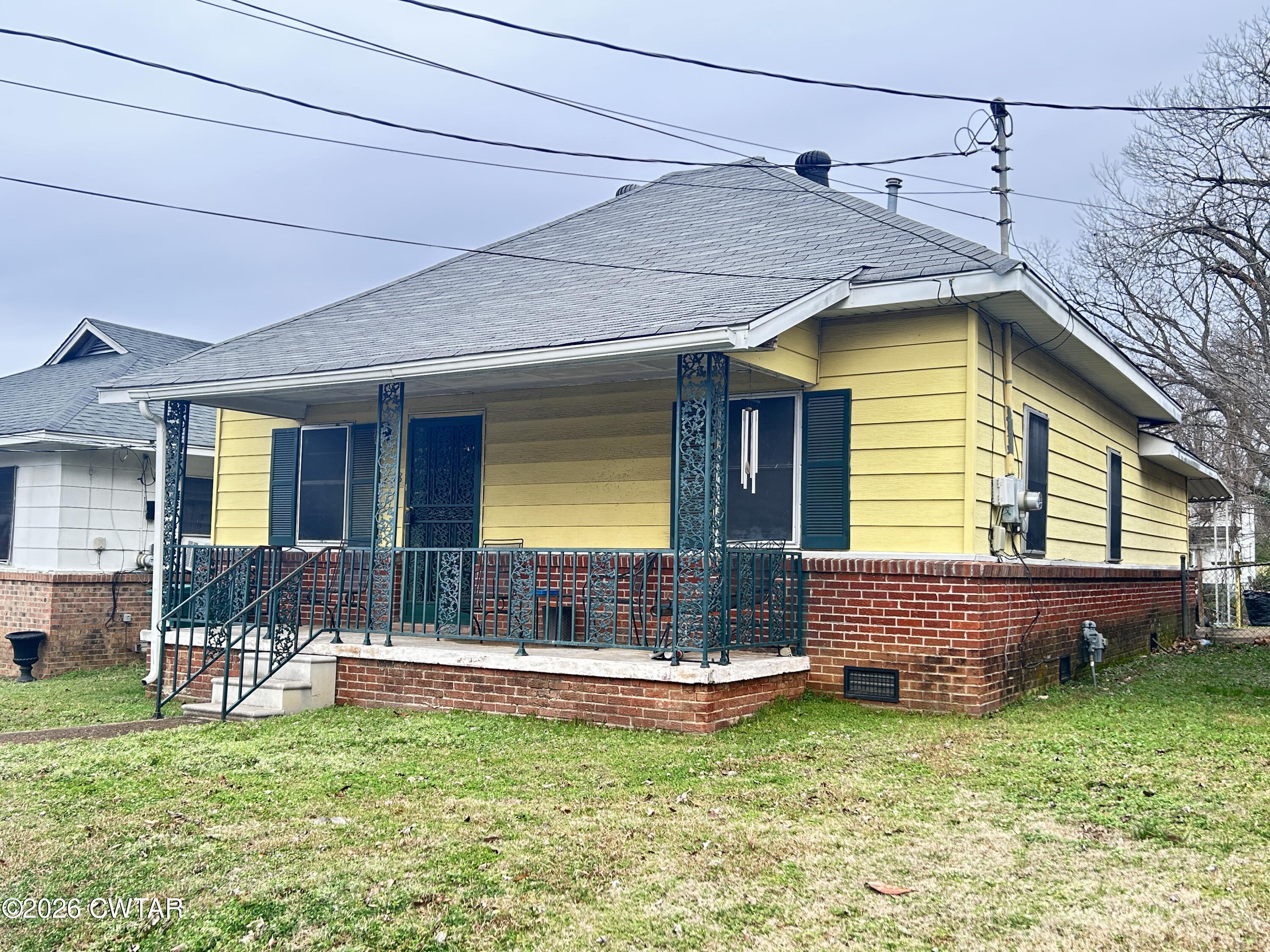 258 Oak Street Jackson, TN 38301 - Photo 20 of 22 a view of house with backyard and swimming pool