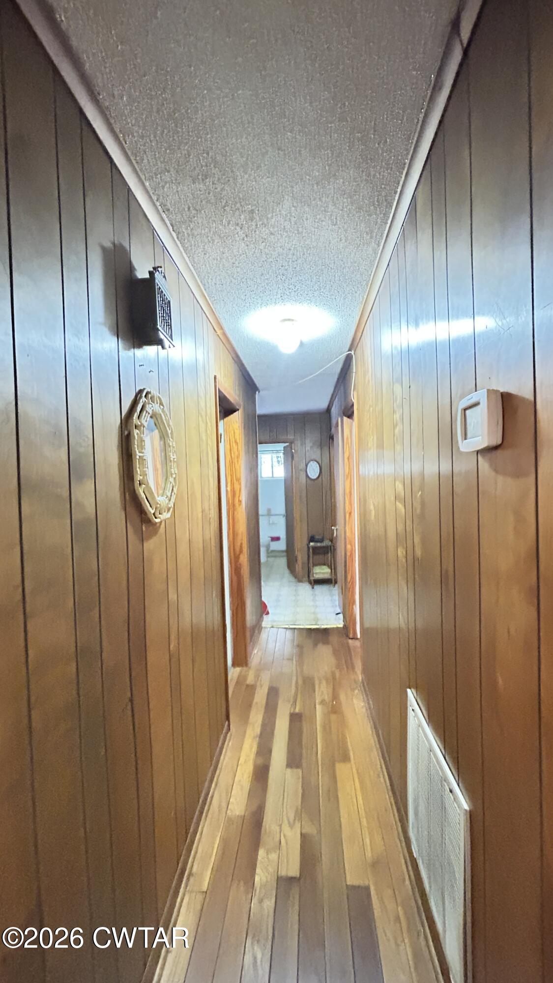 258 Oak Street Jackson, TN 38301 - Photo 4 of 22 a view of a hallway with wooden floor