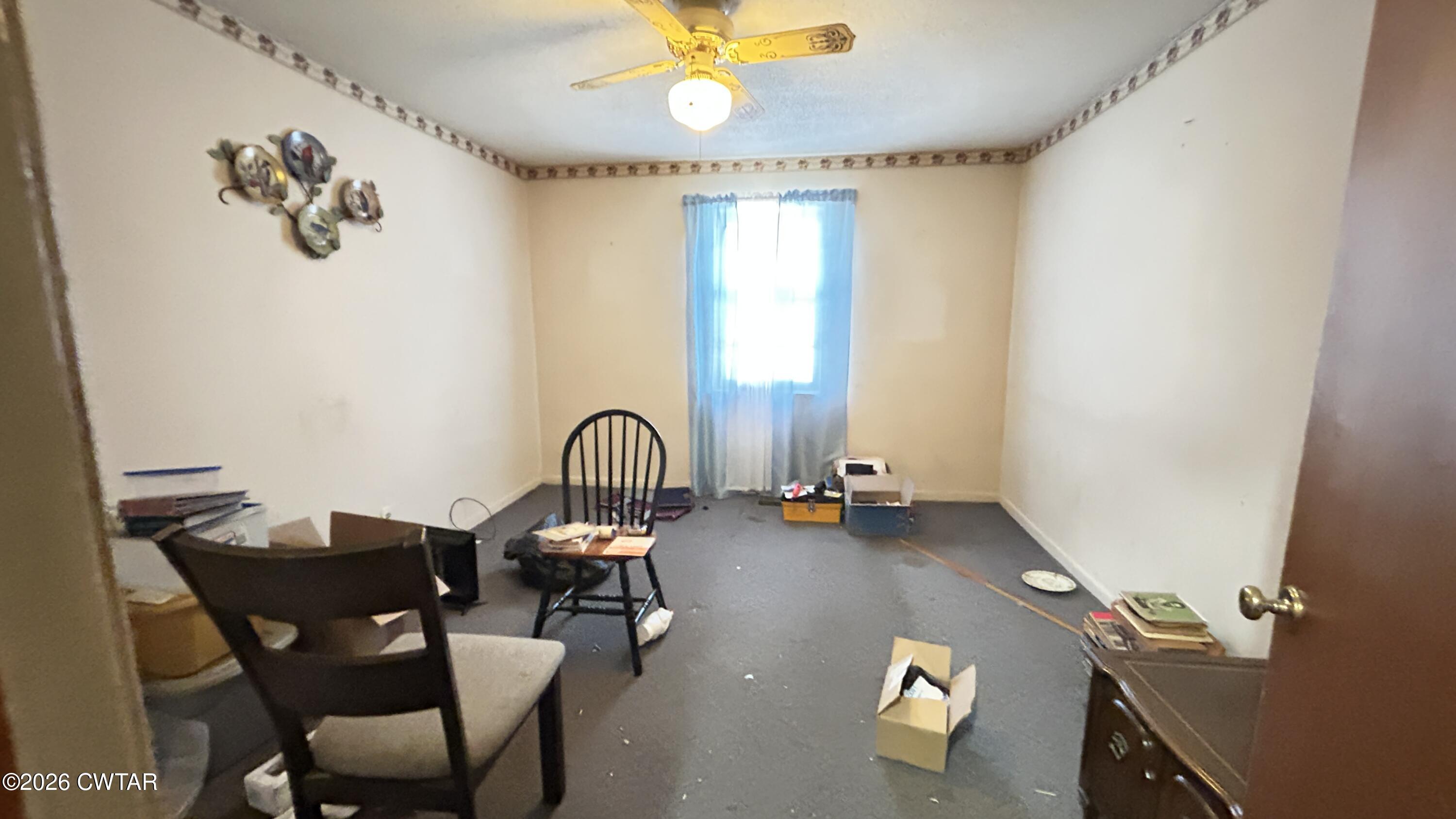 258 Oak Street Jackson, TN 38301 - Photo 5 of 22 a view of a workspace with furniture and a window