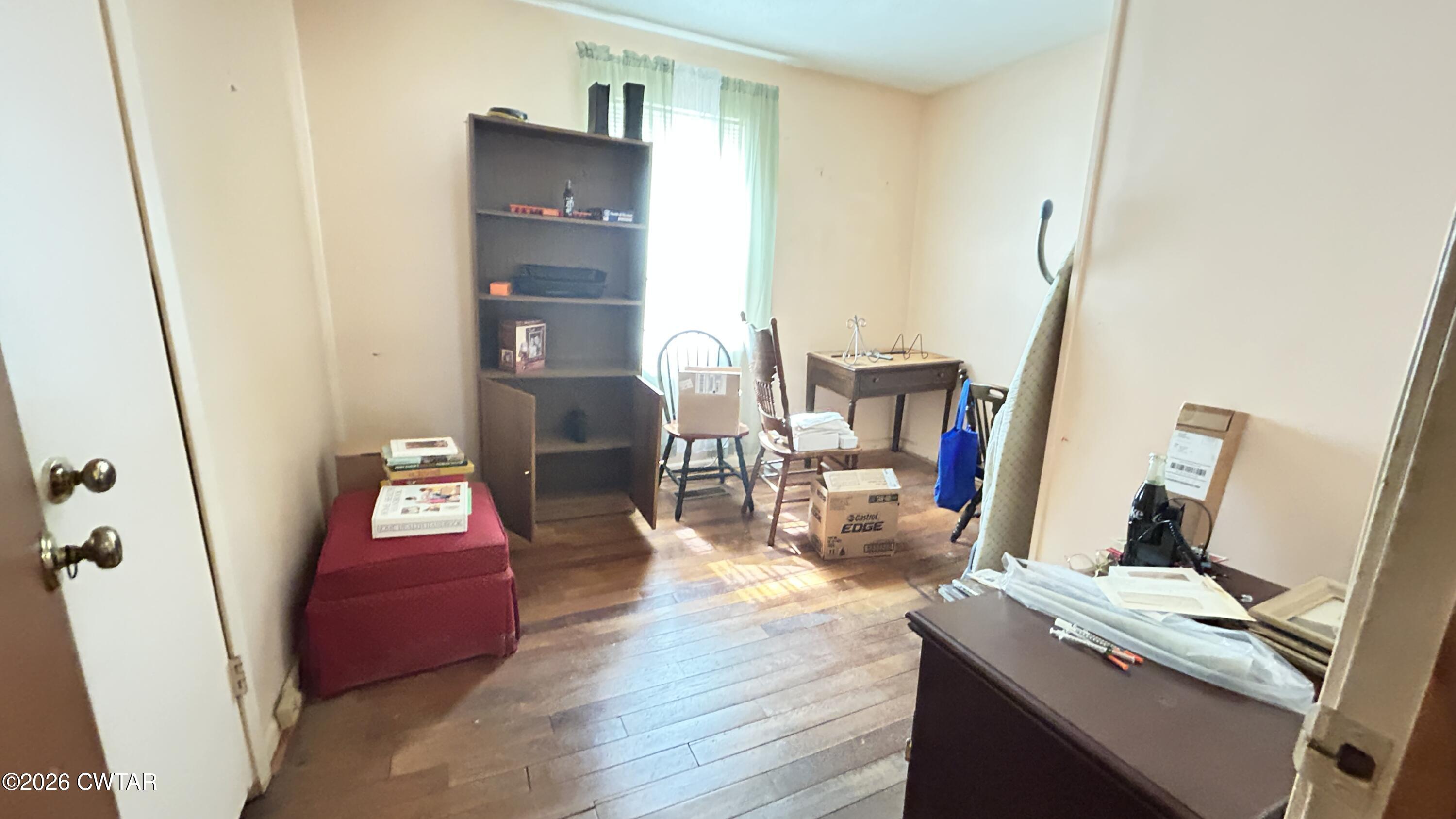 258 Oak Street Jackson, TN 38301 - Photo 6 of 22 a view of a workspace with furniture and wooden floor