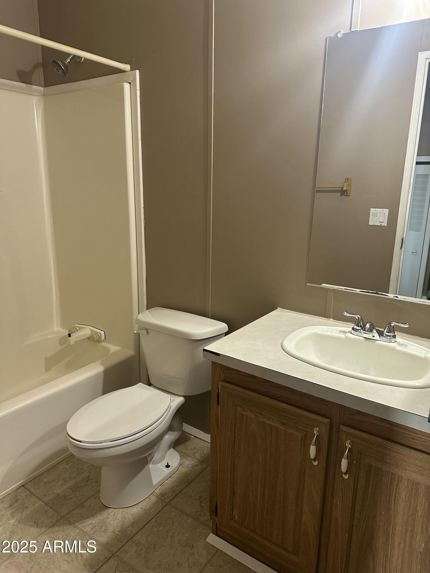 840 North Falton Road Maricopa, AZ 85139 - Photo 16 of 28 a bathroom with a sink toilet and shower