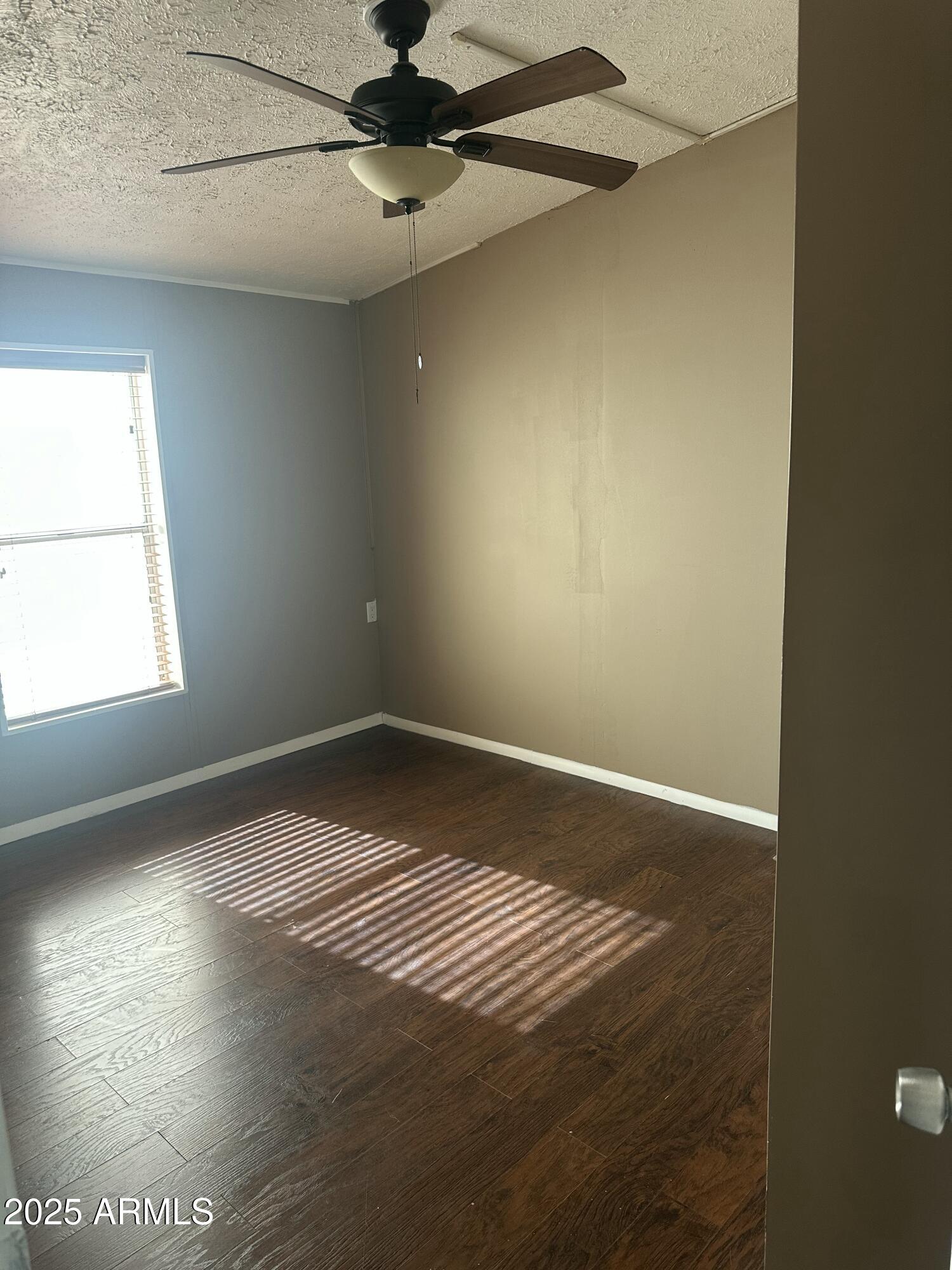 840 North Falton Road Maricopa, AZ 85139 - Photo 19 of 28 a view of an empty room and window