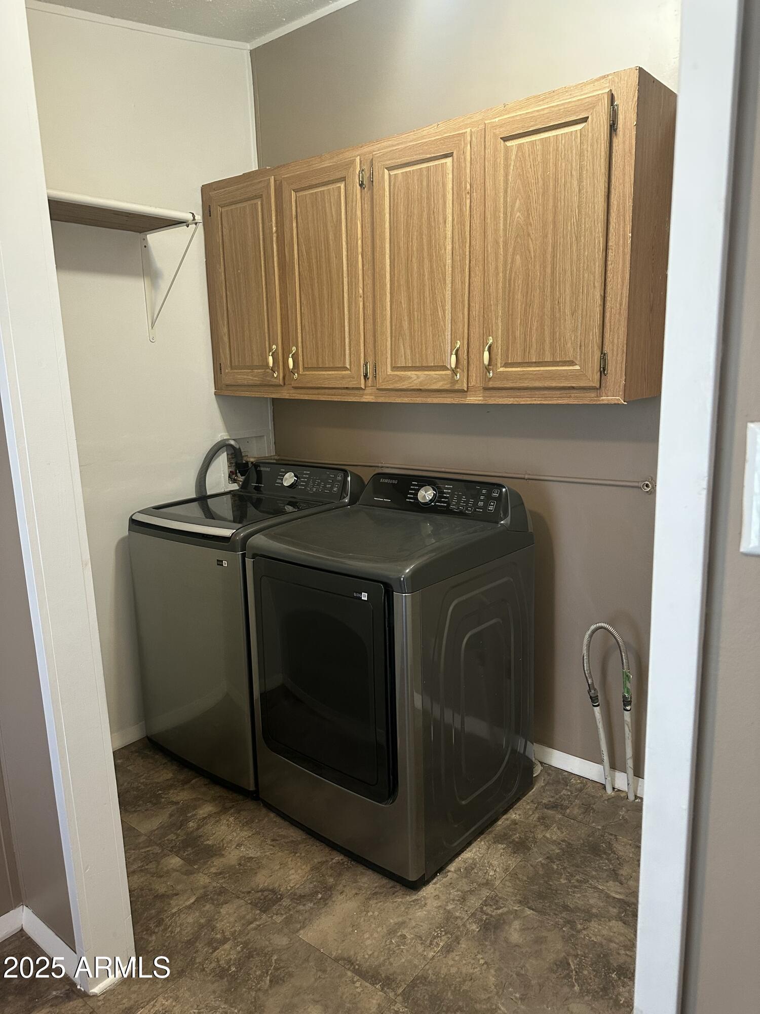840 North Falton Road Maricopa, AZ 85139 - Photo 9 of 28 a utility room with dryer and washer