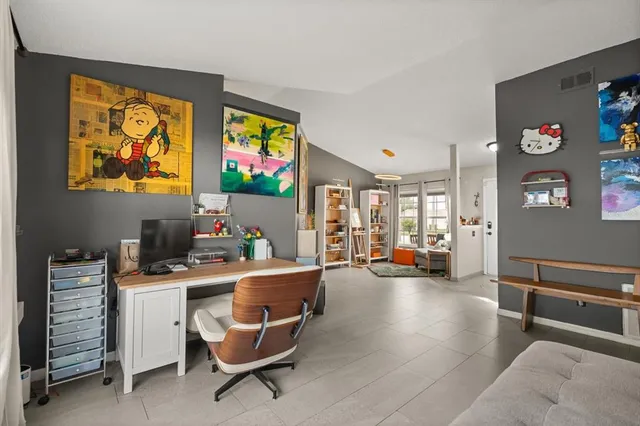 a workspace with furniture and window