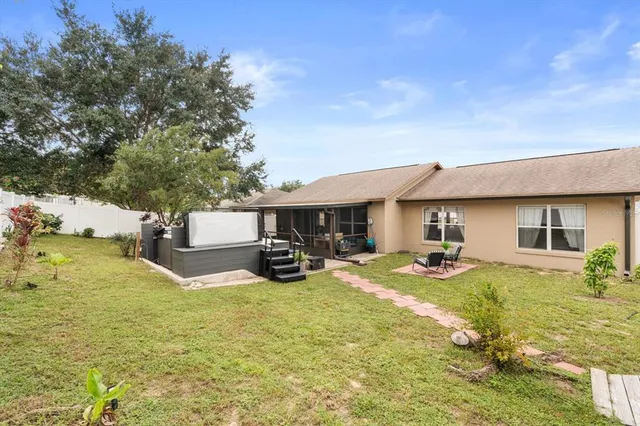 a view of a house with outdoor space and sitting area