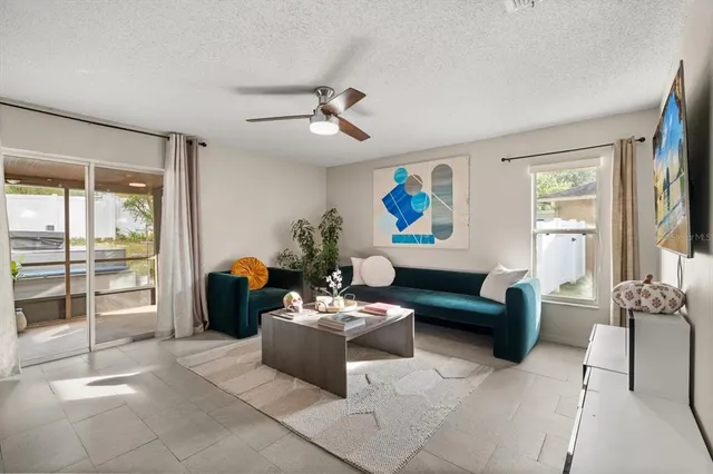 a living room with furniture and a window