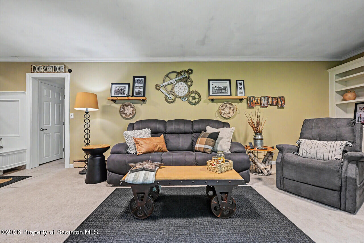 121 T Rt 351 Moscow, PA 18444 - Photo 38 of 79 a living room with furniture a couch and dresser with wooden floor