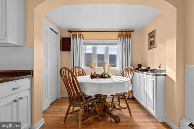 a view of a dining room with furniture and window