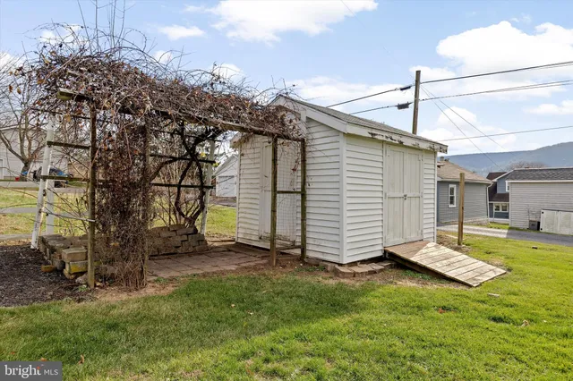 a view of a backyard with potted plants