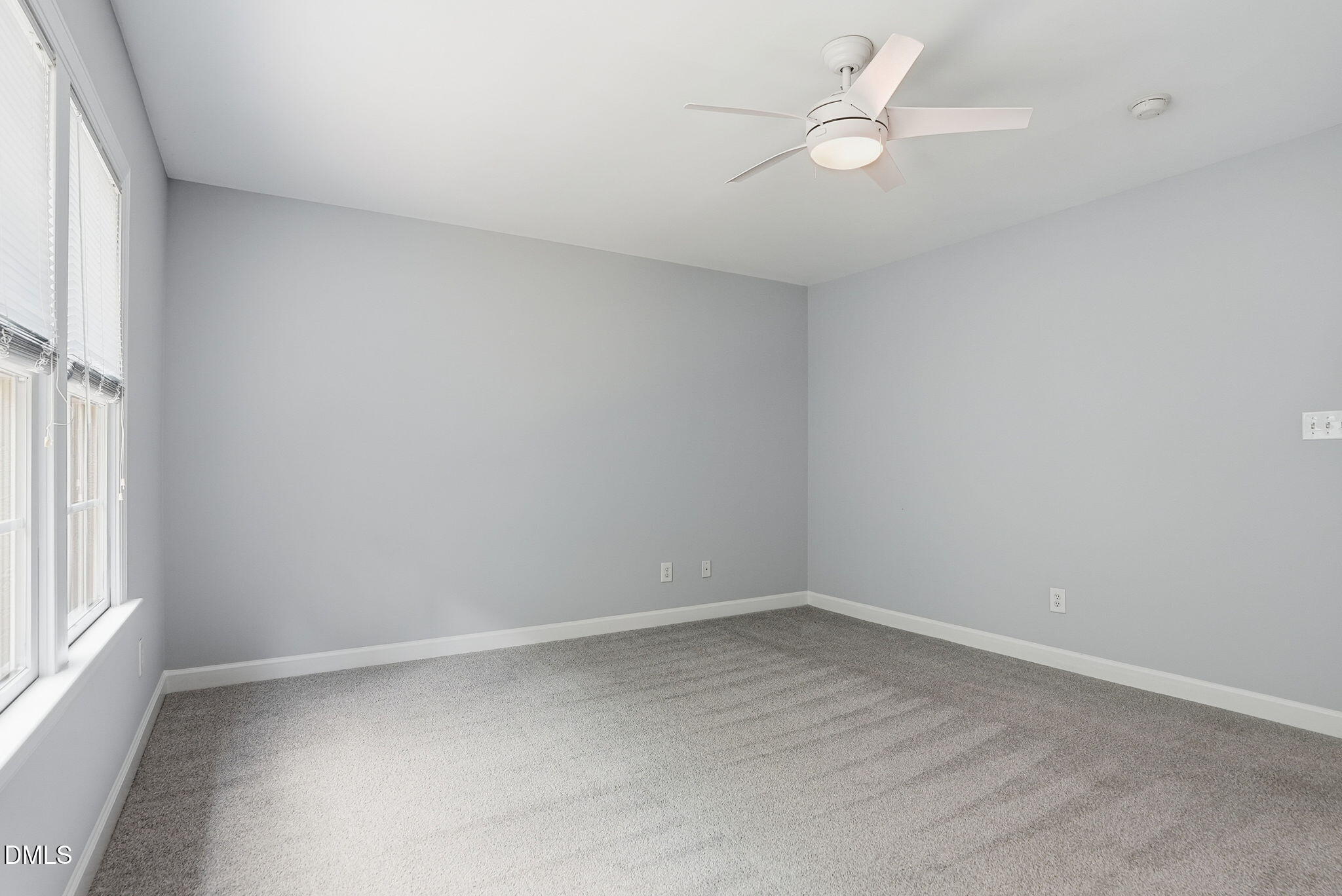 7 Morgans Ridge Lane Durham, NC 27707 - Photo 49 of 75 an empty room with a window and ceiling fan