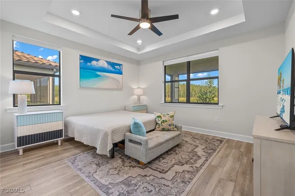 a spacious bedroom with a bed and a window