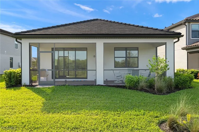 a view of house with backyard