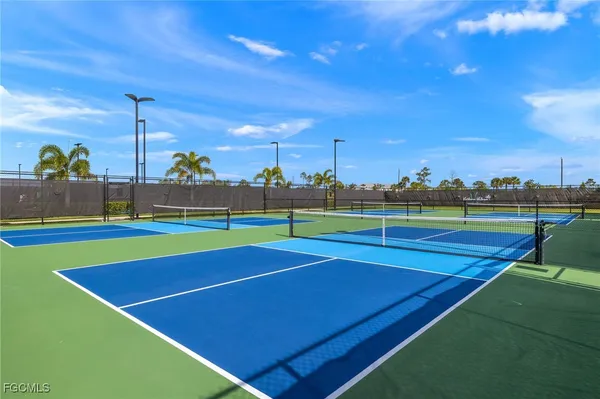 a view of an outdoor space and tennis court