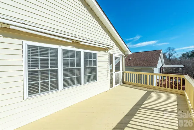 a balcony view with a wooden floor