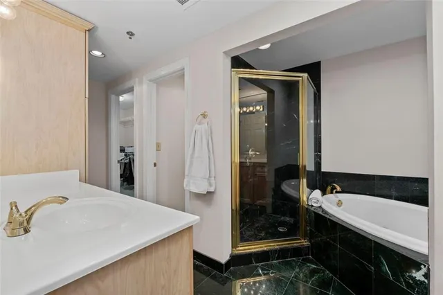 a bathroom with a bathtub and a sink