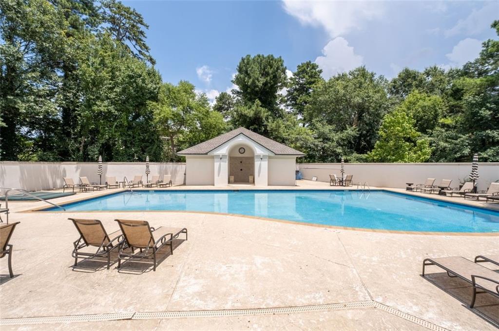 3101 Howell Mill Road Northwest, Unit 227 Atlanta, GA 30327 - Photo 30 of 48 a view of swimming pool with lounge chair