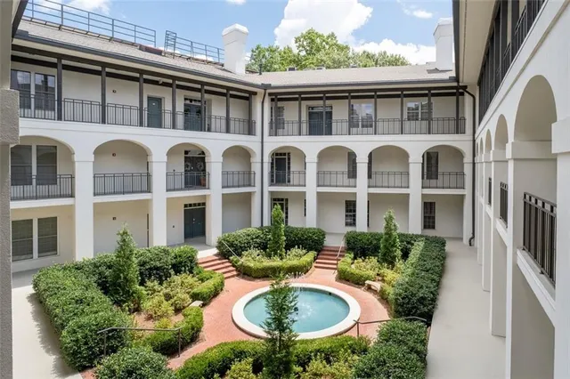 a front view of a house with yard and glass windows