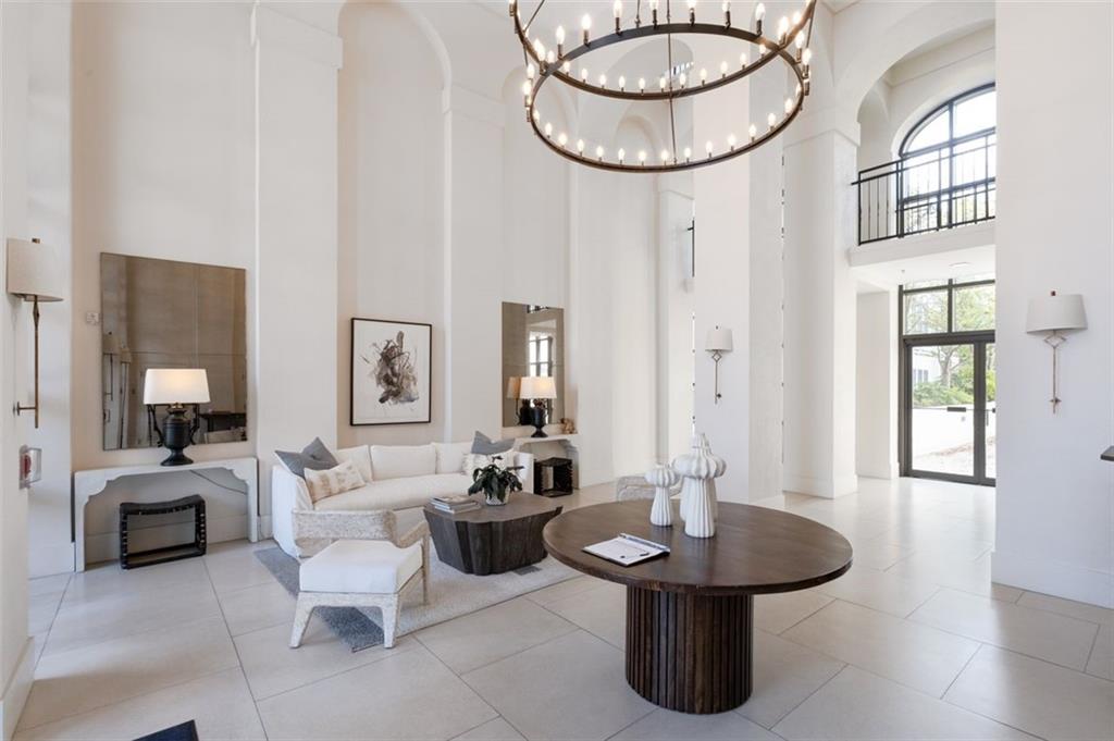 3101 Howell Mill Road Northwest, Unit 227 Atlanta, GA 30327 - Photo 35 of 48 a living room with furniture a table and decor