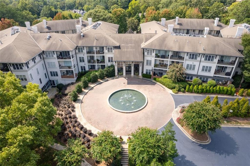 3101 Howell Mill Road Northwest, Unit 227 Atlanta, GA 30327 - Photo 38 of 48 an aerial view of multiple houses with a yard and outdoor seating