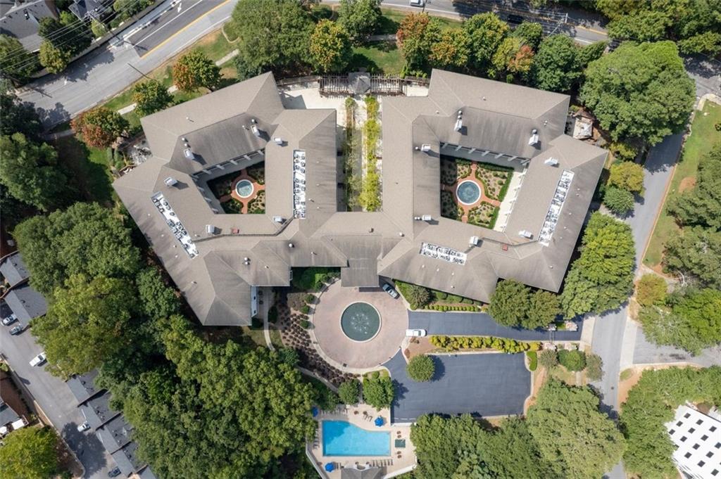 3101 Howell Mill Road Northwest, Unit 227 Atlanta, GA 30327 - Photo 40 of 48 an aerial view of residential house with outdoor space and parking