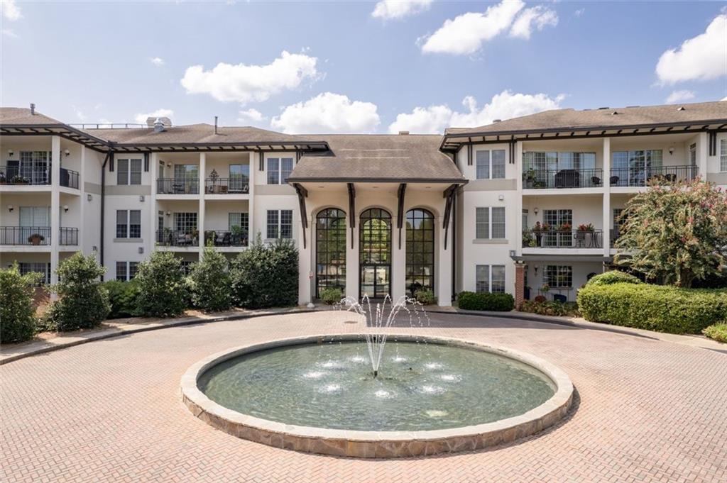 3101 Howell Mill Road Northwest, Unit 227 Atlanta, GA 30327 - Photo 41 of 48 a view of a house with swimming pool and garden