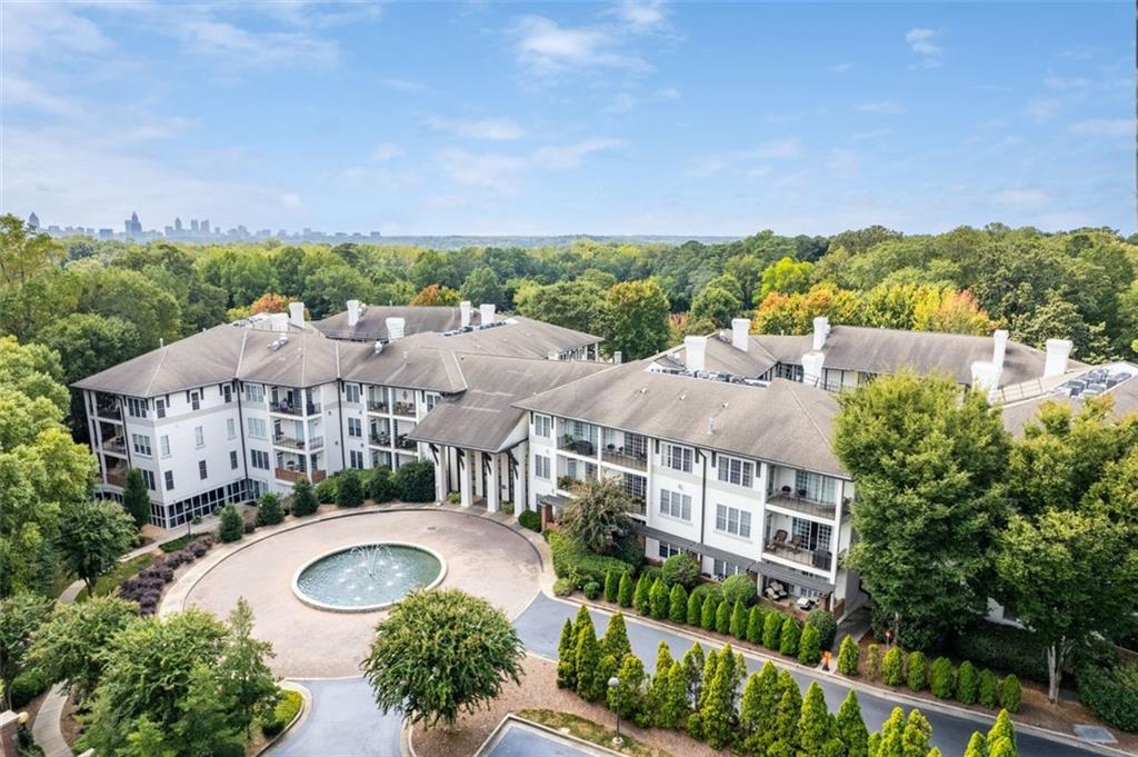 3101 Howell Mill Road Northwest, Unit 227 Atlanta, GA 30327 - Photo 42 of 48 an aerial view of a house with garden space and street view