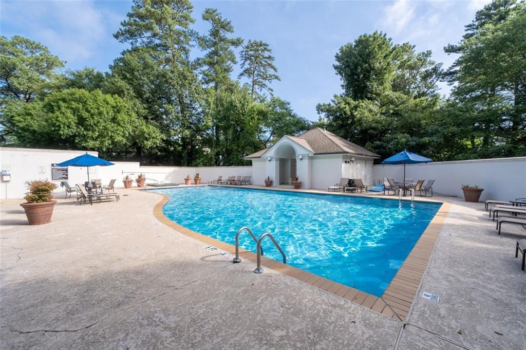 3101 Howell Mill Road Northwest, Unit 227 Atlanta, GA 30327 - Photo 43 of 48 a house view with a outdoor space