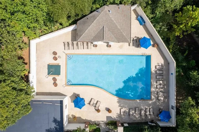 an aerial view of residential house with outdoor space and parking