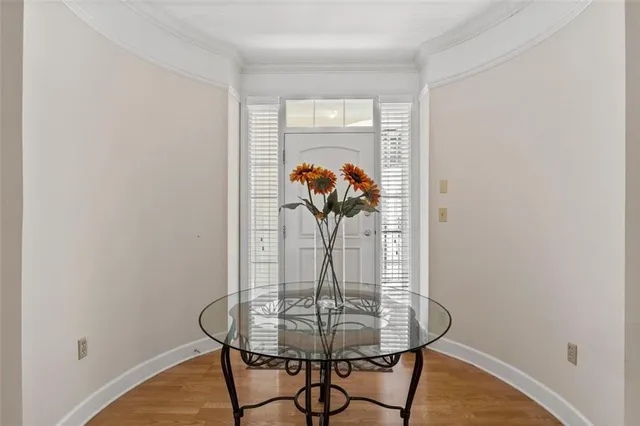 a dining room with table and chairs